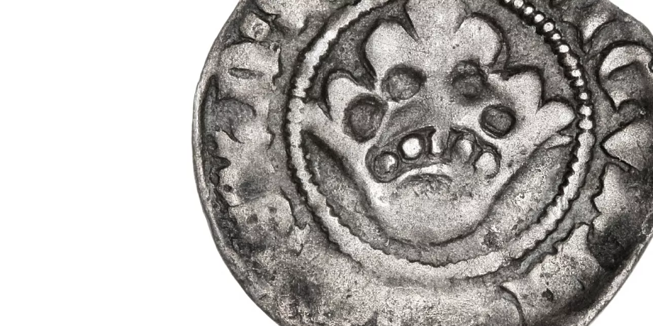 cropped photo of ancient coin