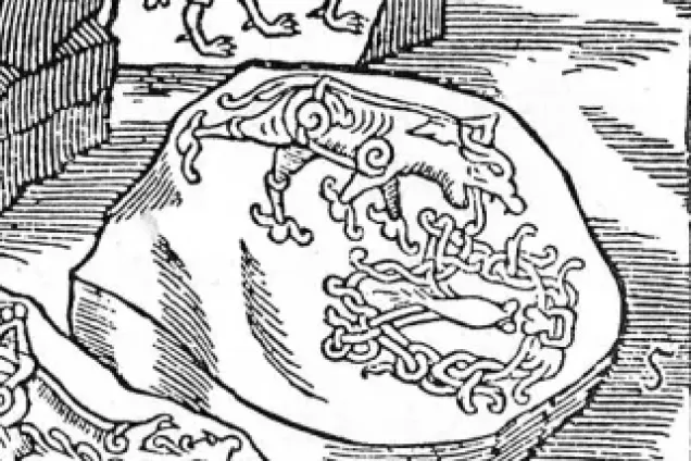 En tecknad bild på en sten som har ett inristat djur.