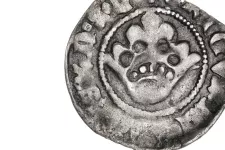 cropped photo of ancient coin